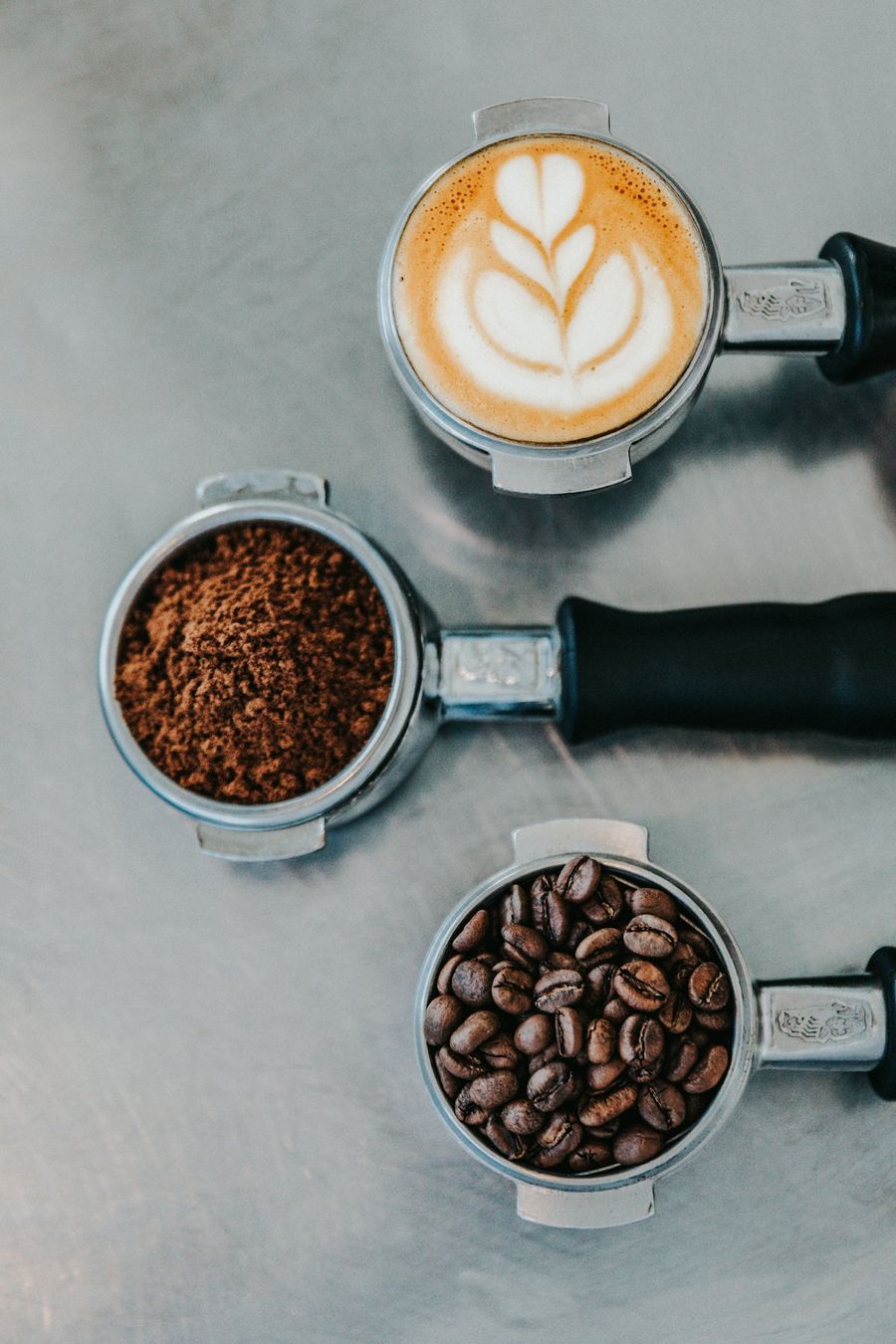 Espresso portafilters with ground and whole coffee